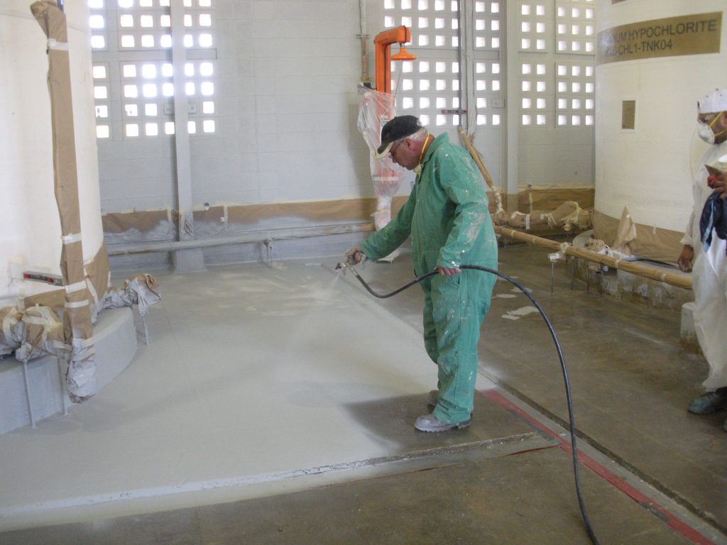 industrial wastewater secondary containment area being sprayed with a protective lining