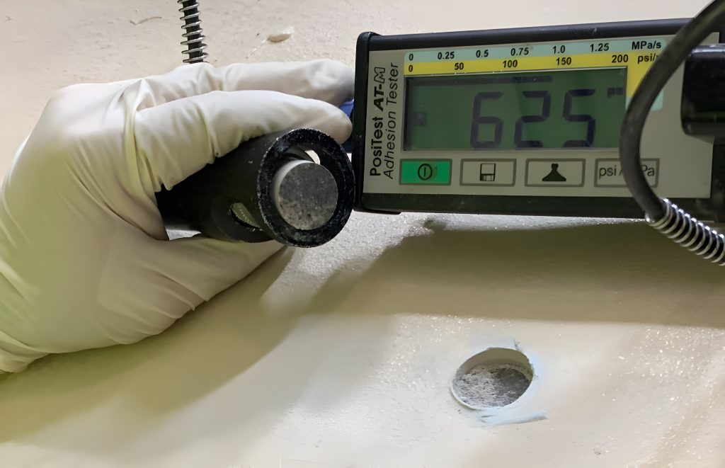 adhesion pull test preformed showing 625 psi sewergard 210 adhesion to concrete failure