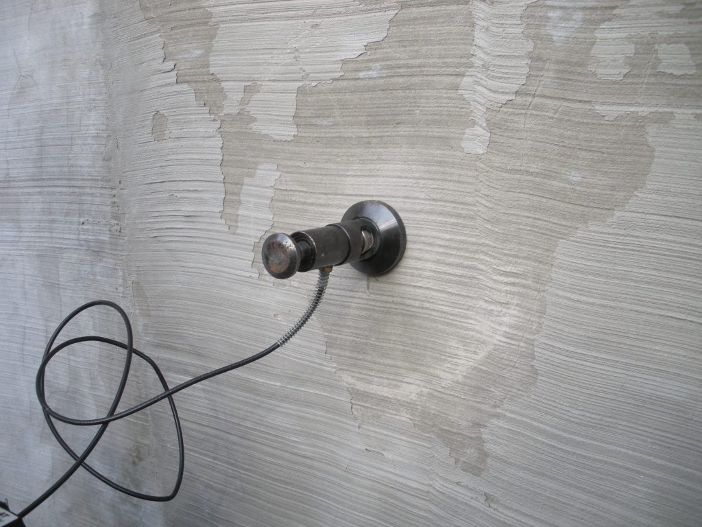 adhesion pull test being preformed on concrete