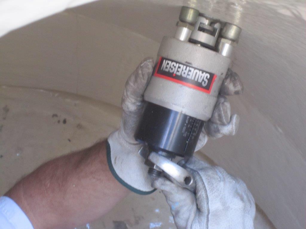 adhesion pull test being preformed in a municipal wastewater manhole